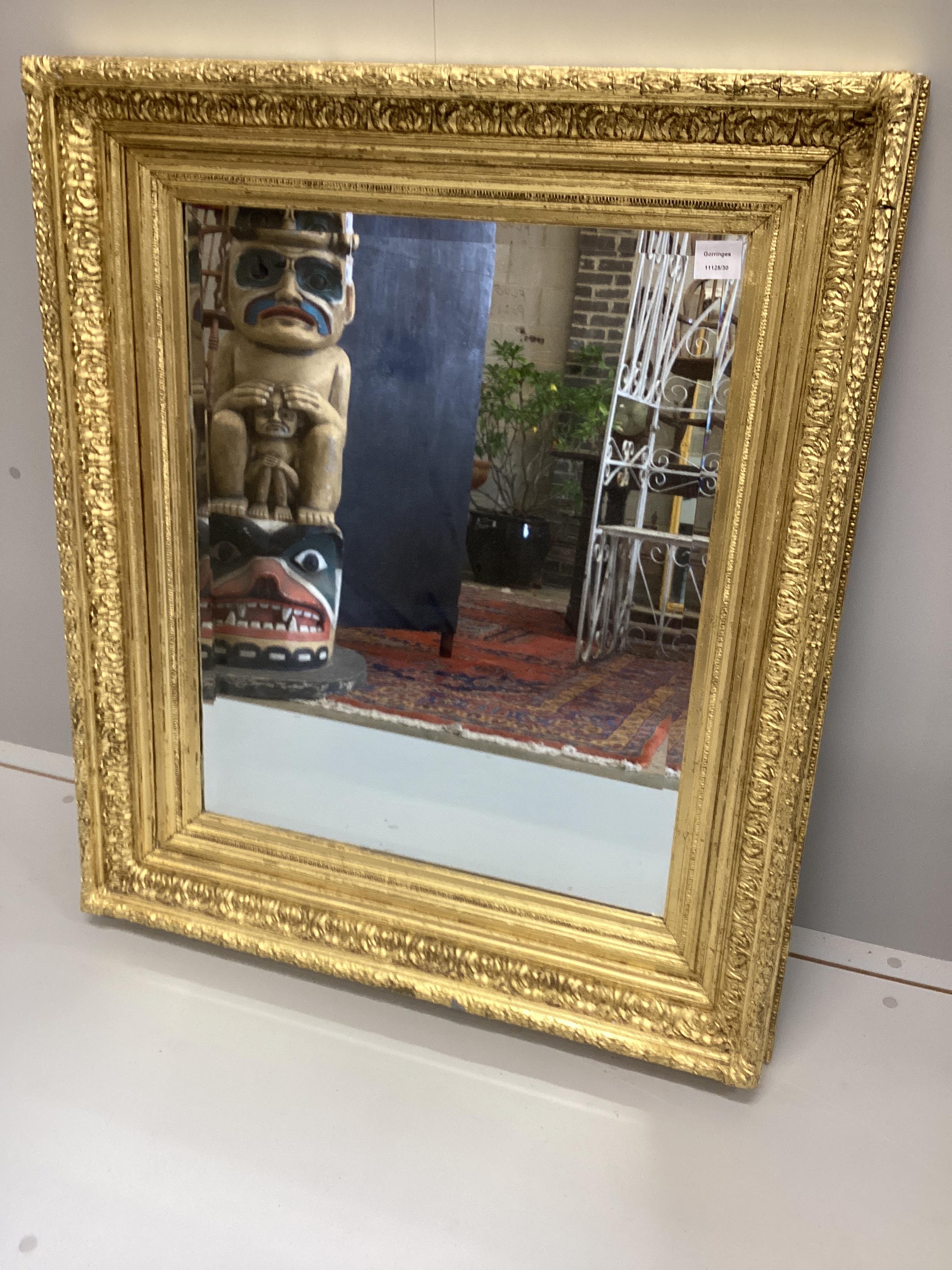 A Victorian giltwood and composition 'picture frame’, now as a wall mirror, width 82cm, height 95cm